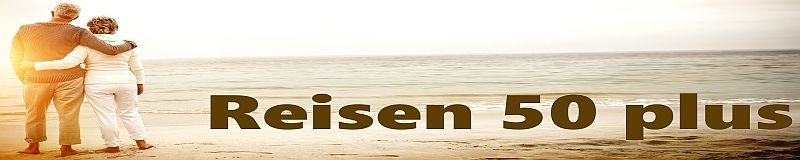 Rear view of senior couple embracing at beach